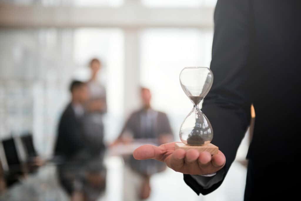 businessman-holding-hour-glass-signifies-importance-being-time